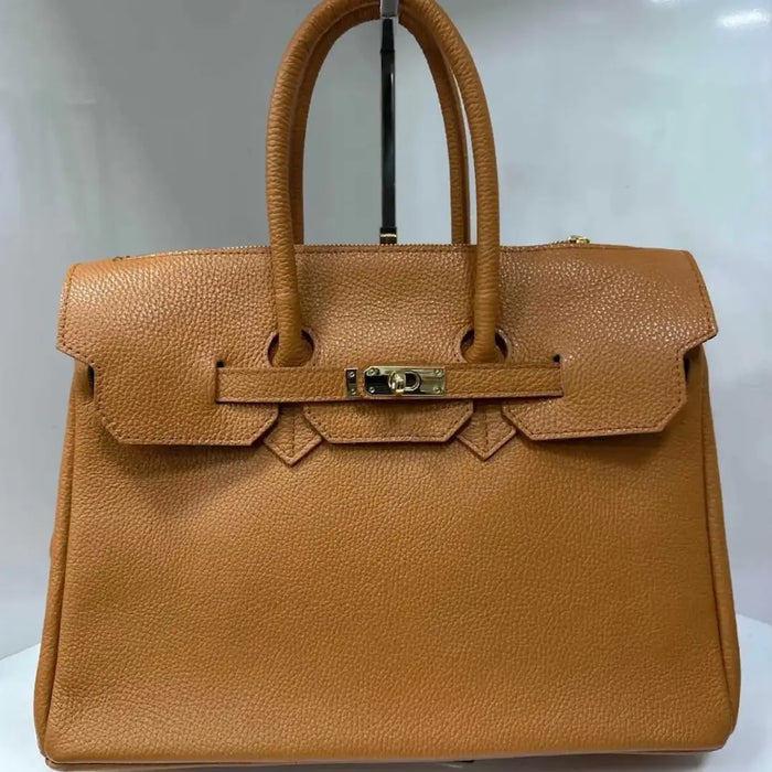 NEW! SFCA LEATHER CAMEL HANDBAG STRUCTURED AND LOCK CLOSURE